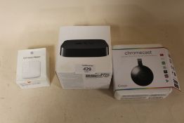 AN APPLE TV BOX TOGETHER WITH A GOOGLE CHROMECAST AND AN APPLE USB POWER ADAPTER