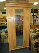 AN OLD PINE MIRRORED WARDROBE