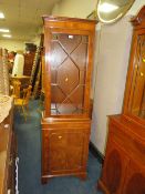 A SLIM YEW WOOD GLAZED BOOKCASE H-181 W-56 CM