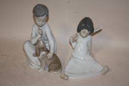 A LLADRO FIGURE OF A SEATED CHERUB, TOGETHER WITH A LLADRO FIGURE OF A SEATED BOY AND DOG (2)
