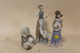 THREE LLADRO FIGURES COMPRISING OF A FIGURE OF AN ESKIMO PLAYING WITH A POLAR BEAR CUB, GIRL HOLDING
