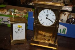 A BROOKS AND BOSTOCK QUARTZ CARRIAGE CLOCK WITH A EIGHT DAY BRASS AND GLASS CHIMING MANTEL CLOCK