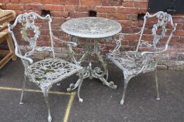 A CIRCULAR GARDEN TABLE WITH 2 MATCHING CHAIRS