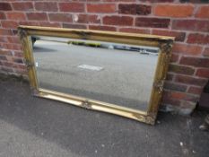 A CONTEMPORY RECTANGULAR GILT FRAMED MIRROR 78 X 139 CM