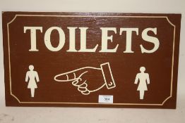 A PAINTED WOODEN TOILET SIGN - 46CM X 25.5CM