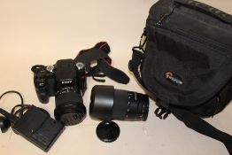 A SONY A100 DIGITAL CAMERA WITH CARRY CASE