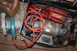 A TULL BENCH GRINDER AND TROLLEY JACK