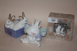 A NAO FIGURE OF RABBITS IN A BASKET, TOGETHER WITH A NAO SEATED RABBIT FIGURE AND A LLADRO OF A