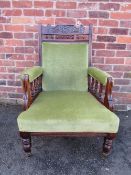 AN EDWARDIAN MAHOGANY CARVED GENTLEMANS ARMCHAIR