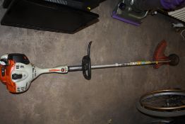 A STHIL FS70 RC PETROL STRIMMER PLUS HARD HAT