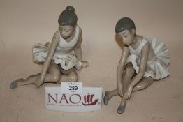 TWO NAO SEATED BALLERINA FIGURES, TOGETHER WITH A NAO CERAMIC ADVERTISING SIGN (3)