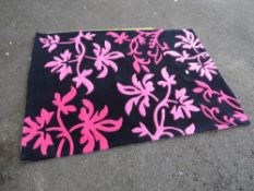 A MODERN B & Q WOOLLEN RUG 120 X 170 CM