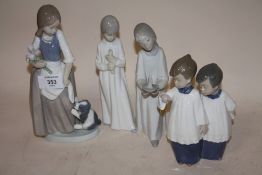 FOUR ASSORTED NAO FIGURES TO INCLUDE A FIGURE OF A GIRL HOLDING FLOWERS WITH A PUPPY