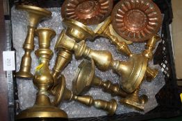 A COLLECTION OF BRASS CANDLESTICKS, COPPER DISHES ETC.