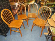 A SET OF FOUR HOOP BACK CHAIRS
