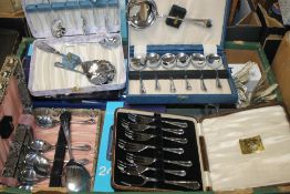 A TRAY OF CASED AND BOXED FLATWARE AND A PAIR OF WHITE METAL COCKERELS (TRAY NOT INCLUDED)