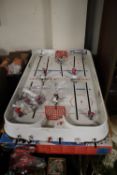 A TABLE TOP ICE HOCKEY GAME TOGETHER WITH A BOXED MICRO SUPER ENDURANCE SCALEXTRIC