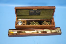 A CASED POWELL PART GUN CLEANING SET TOGETHER WITH ANOTHER