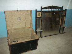 AN ANTIQUE OVER MANTEL MIRROR AND A WOODEN TRAVEL TRUNK