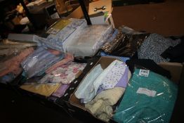 SIX TRAYS OF BEDLINEN, CLOTHES, BATHROOM MATS ETC (TRAYS NOT INCLUDED)