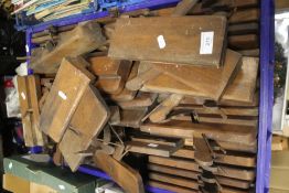 A TRAY OF WOODEN PLANES