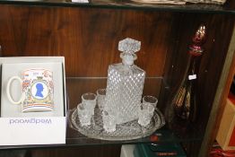A CUT GLASS DECANTER AND BRANDY GLASSES ON TRAY, A COLOURED GLASS DECANTER AND A BOXED 