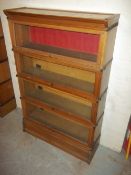 A WERNICKE STYLE SECTIONAL BOOKCASE BY A. M. Y. L.