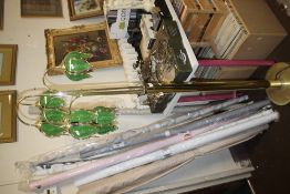 A BRASS FLOOR STANDING LAMP