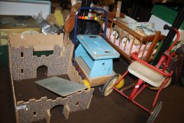 A QUANTITY OF CHILDREN'S TOYS TO INCLUDE A TRICYCLE, A COT, MODEL FORT ETC.