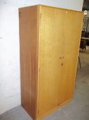 A LIGHT OAK WARDROBE