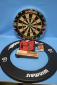 A WINMAU DARTBOARD WITH COVER, DARTS AND FLIGHTS