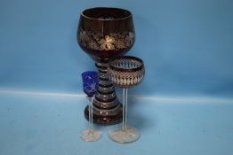 AN EGERMANN BOHEMIAN RUBY OVERLAY GLASS GOBLET WITH GRAPE AND VINE DECORATION TOGETHER WITH TWO