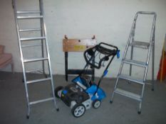 A SELECTION OF ITEMS INCLUDING TWO STEP LADDERS, A BLACK & DECKER WORKMATE, A MACALLISTER ELECTRIC