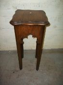 AN ANTIQUE OAK PLANT STAND