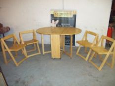 A STORAWAY KITCHEN TABLE AND FOUR CHAIRS