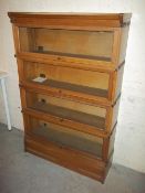 A WERNICKE STYLE SECTIONAL BOOKCASE BY A. M. Y. L.