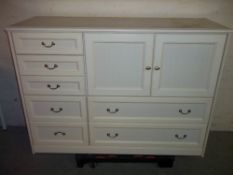A MODERN SIDEBOARD WITH SEVEN DRAWERS