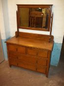 AN ANTIQUE OAK DRESSING TABLE