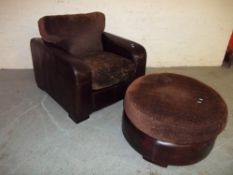 A SOFA CHAIR AND MATCHING POUFFE