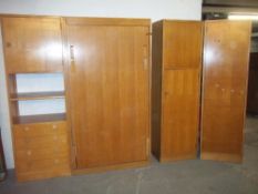 A GOLDEN OAK BEDROOM SET WITH WARDROBE, CUPBOARDS, DRAWERS AND DROP DOWN BED