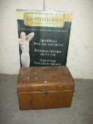 A LARGE METAL TRAVEL TRUNK