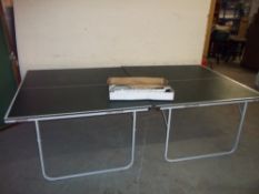 A TABLE TENNIS TABLE WITH ACCESSORIES