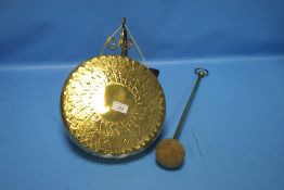 A BRASS GONG AND BEATER