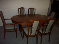 A STAG EXTENDING DINING TABLE WITH SIX CHAIRS