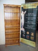 A NARROW PINE BOOK SHELF