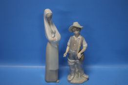 A LLADRO FIGURE OF A BOY AND A NAO FIGURURINE OF A GIRL
