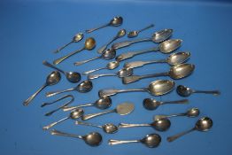 A COLLECTION OF WHITE METAL SPOONS