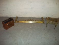A BRASS TABLE PLANT STAND, A BRASS FIRE FENDER AND A MAGAZINE RACK