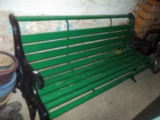 A GREEN CAST GARDEN BENCH
