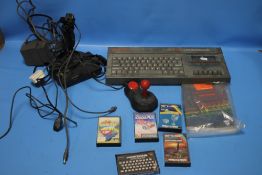 A SINCLAIR ZX SPECTRUM +2 WITH A SMALL COLLECTION OF GAMES, JOY STICK ETC. A/F
